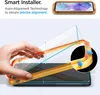 A hand is shown installing a screen protector onto a smartphone using an alignment frame. The image highlights the "Smart Installer" feature with "Auto-Alignment Technology." Náhľad obrázku produktu