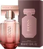 A bottle of Hugo Boss The Scent for Her perfume and its packaging are displayed against a white background. Voir les images du produit
