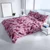 A bed with pink and purple floral patterned bedding in a bright, modern room with a large window. Produktbild-Vorschau