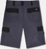 The back view of a pair of grey and black cargo shorts. Produktbild-Vorschau