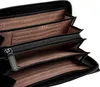 A close-up view of the interior of an open black wallet, showing multiple compartments and card slots lined with brown fabric. Anteprima dell’immagine prodotto