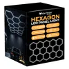 The image shows the packaging of a hexagon LED panel light. The packaging is black with orange and white text and graphics. It features an image of the LED panels arranged in a hexagonal pattern on a ceiling, and a car in a garage illuminated by similar li Náhled obrázku produktu