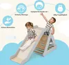 Two children are playing on a wooden climbing triangle with a slide indoors. The image has informational icons and text overlays. Anteprima dell’immagine prodotto