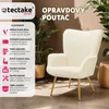 A cream-colored boucle armchair with gold legs, set against a light beige wall and floor. The armchair is surrounded by plants and a woven basket. Náhled obrázku produktu
