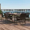 An outdoor dining set on a wooden deck overlooking the ocean. Produktbild-Vorschau