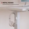A close-up view of a white desk with a pair of white headphones hanging from a metal hook attached to the underside of the desk. Podgląd zdjęcia produktu
