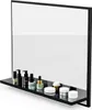A black shelf with various cosmetic products displayed in front of a large mirror. Podgląd zdjęcia produktu