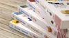 A stack of children's learning books on a wooden surface. Produktbild-Vorschau