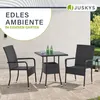 An outdoor patio set with a table and two chairs, set on a paved patio with a wall and greenery in the background. Produktbild-Vorschau