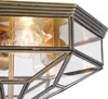 A close-up view of a light fixture with glass panels and visible bulbs. Anteprima dell’immagine prodotto