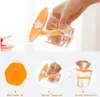 A collage showing silicone cup lids in use and as a product shot. Produktbild-Vorschau