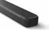 A close-up, angled view of the right end of a black soundbar against a white background. Voir les images du produit