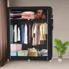 An open black fabric wardrobe with clothes hanging on racks and items stored on shelves. Produktbild-Vorschau