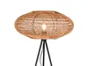 A close-up shot of a floor lamp with a woven lampshade. Produktbild-Vorschau