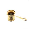 A traditional coffee pot with ornate gold detailing. Produktbild-Vorschau