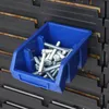 A blue storage bin filled with screws and bolts, placed on a rack of similar bins. Anteprima dell’immagine prodotto