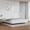 A white bed frame with a gray blanket is shown in a bedroom setting. Anteprima dell’immagine prodotto