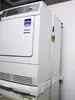 A white washing machine and dryer stacked on top of each other in a room. Anteprima dell’immagine prodotto