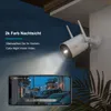 A security camera mounted on a wall, with a smartphone displaying a live feed of a street at night. Náhled obrázku produktu