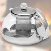 A close-up studio shot of a glass teapot with a stainless steel lid and handle, featuring an integrated tea infuser. Produktbild-Vorschau