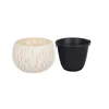 A white decorative outer pot and a black inner pot are shown side-by-side on a white background. Náhľad obrázku produktu