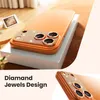 A close-up of a phone case with diamond-like embellishments on the camera module, placed on a white box. Produktbild-Vorschau