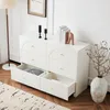 A white sideboard with six drawers is shown in a room with a floor lamp and a rug. Anteprima dell’immagine prodotto