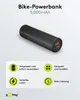A black cylindrical power bank with orange USB ports is shown, with text and icons describing its features. Produktbild-Vorschau