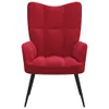 A red velvet armchair with black legs is shown against a white background. Náhled obrázku produktu