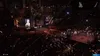A boxing ring in a large arena with a crowd watching. Produktbild-Vorschau