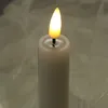 A close-up shot of a white LED candle with a flickering yellow flame. Produktbild-Vorschau