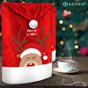 Christmas-themed chair covers and a cup of coffee on a wooden table with a blurred Christmas tree background. Produktbild-Vorschau