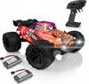 A remote-controlled off-road car with its controller and two batteries, presented on a white background. Anteprima dell’immagine prodotto
