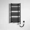 A black electric towel radiator mounted on a textured white wall, with its power cord plugged into a wall socket. Produktbild-Vorschau