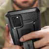 A person is holding a black smartphone in a protective case. Náhled obrázku produktu