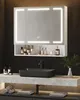 A modern bathroom vanity with a lighted mirror, sink, and accessories. Voir les images du produit