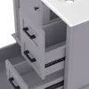 A close-up view of a gray bathroom vanity with drawers and a white ceramic sink top. Anteprima dell’immagine prodotto