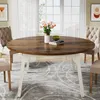 A round dining table with chairs in a dining room setting. Náhľad obrázku produktu