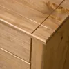 A close-up view of the corner of a wooden sideboard. Náhľad obrázku produktu