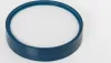 A close-up, isolated shot of a round filter with a blue rim and a white mesh interior, set against a plain white background. Produktbild-Vorschau