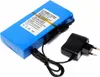 A blue rechargeable lithium-ion battery pack with a black power adapter and cable, shown on a white background. Produktbild-Vorschau