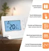 A white thermostat is shown on a wooden surface, with feature callouts on the right side. Produktbild-Vorschau
