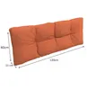 A long, orange cushion with tufted sections, shown with dimensions indicated by arrows and text. Voir les images du produit