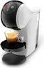A white and black De'Longhi capsule coffee machine with a glass cup of espresso. Produktbild-Vorschau