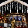 Christmas lights decorating a house at night. Anteprima dell’immagine prodotto