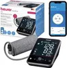 A collage of a Beurer medical blood pressure monitor, its packaging, and a smartphone displaying the companion app. Podgląd zdjęcia produktu