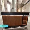 A reception desk in a workshop or warehouse setting. Voir les images du produit