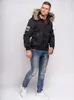 A man wearing a winter jacket and jeans, posing against a white background. Náhled obrázku produktu