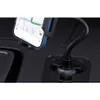 A close-up view of a car phone holder mounted in a cupholder, with a smartphone displaying navigation. Náhľad obrázku produktu