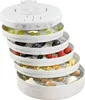 A white food dehydrator with multiple stacked trays filled with various fruits and mushrooms. Anteprima dell’immagine prodotto